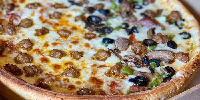 Create your own specialty deep dish pizza, like this half sausage and half olive mushroom pie in Idaho at Chicago Connection pizza parlor and Italian restaurant in Idaho