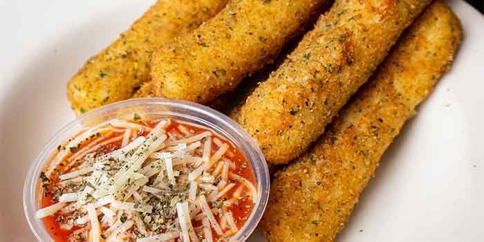 Four breaded mozzarella sticks, marinara, and cheese—classic on the Chicago Connection menu.